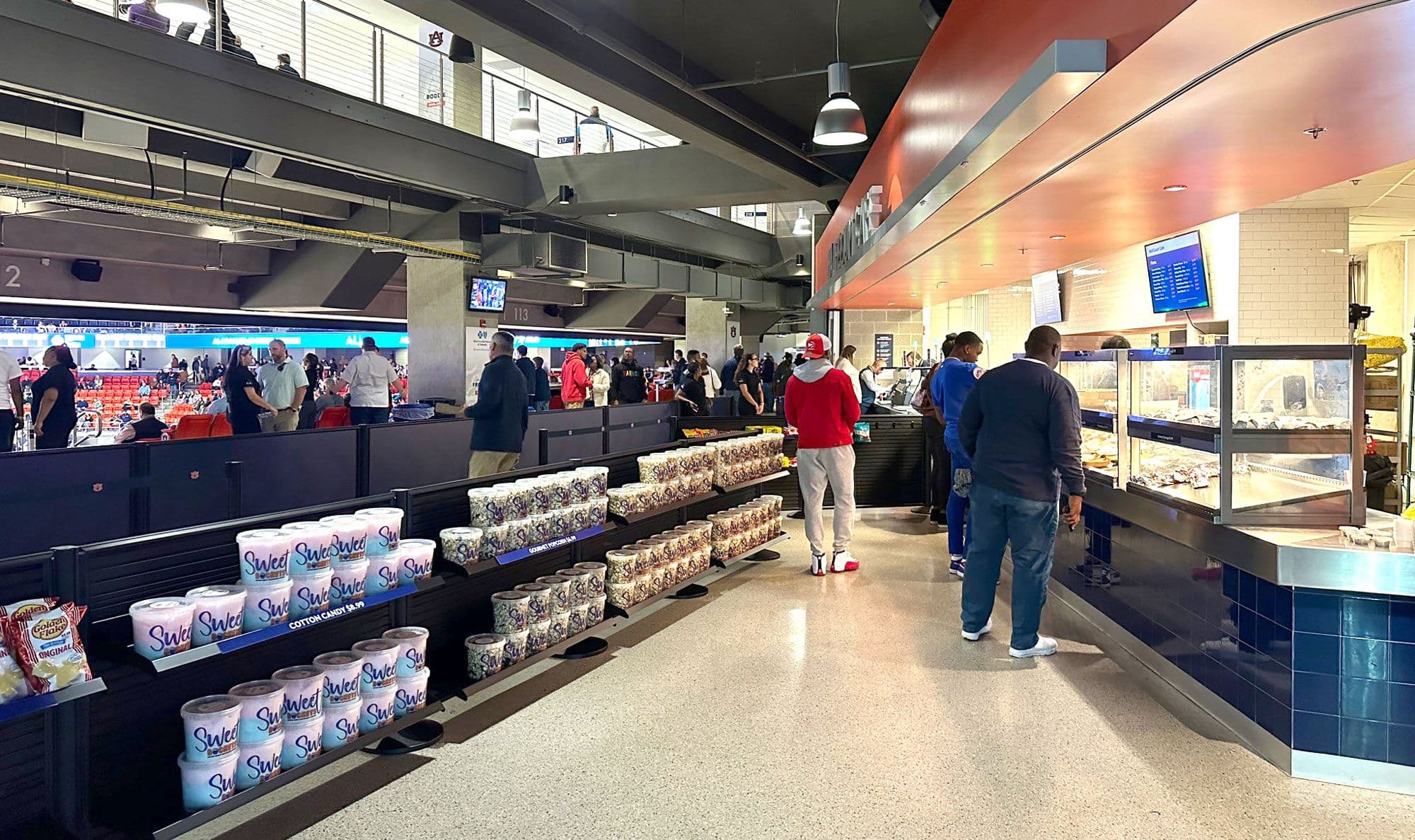 NeXtrac slatwall panels merchandise snacks along the concession queue at Jordan-Hare Stadium at Auburn University.