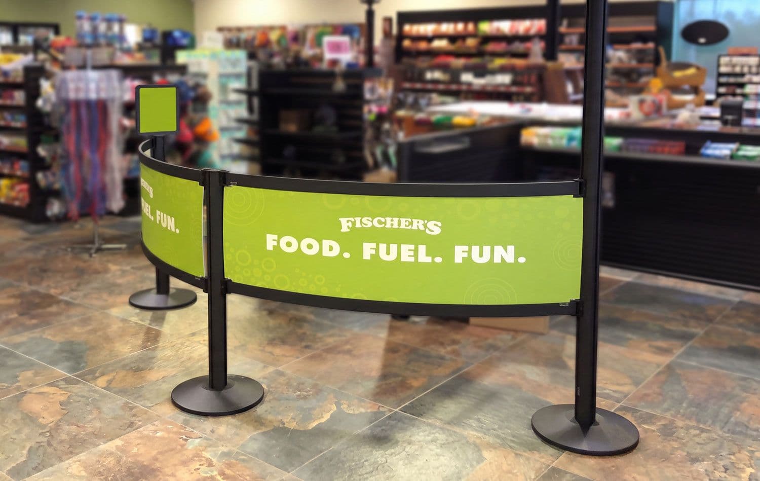 Rigid Rail Barriers in a convenience store checkout queue