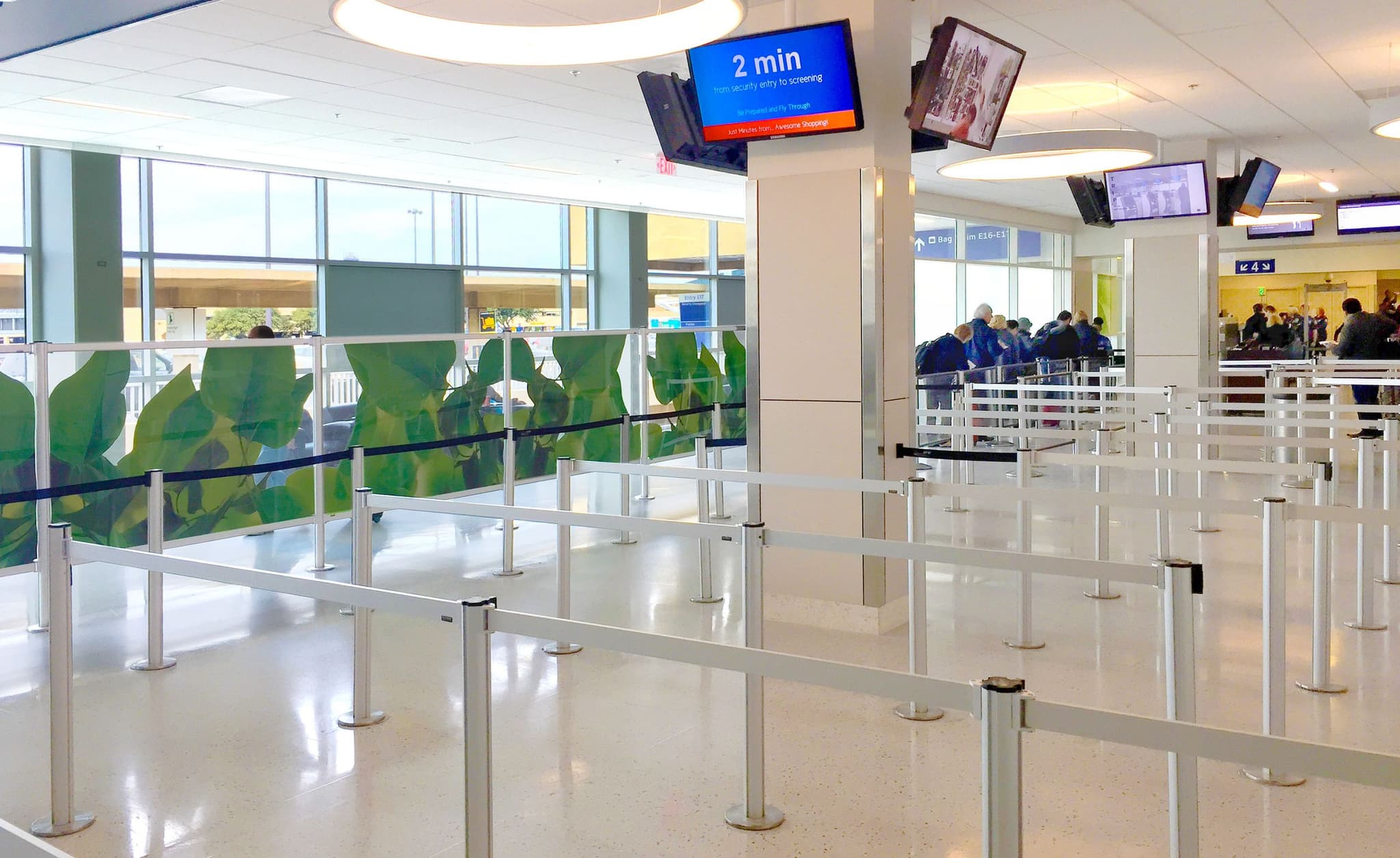Magnetic partition posts with Rigid Rail barriers form the security queue at Dallas Fort Worth International Airport.