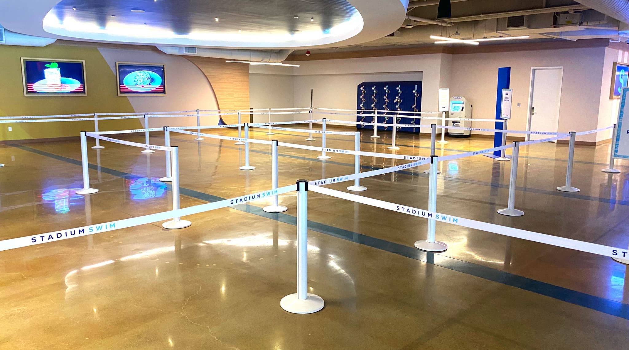 Beltrac retractable belt stanchions with custom printed belts guide guests into Stadium Swim at Circa Resort in Las Vegas.