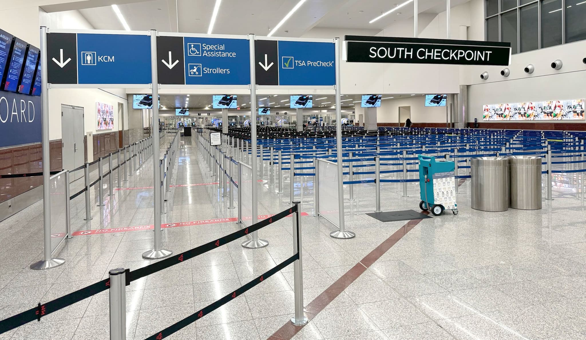 Overhead signs direct passengers into the south security checkpoint at Hartsfield-Jackson Atlanta International Airport.