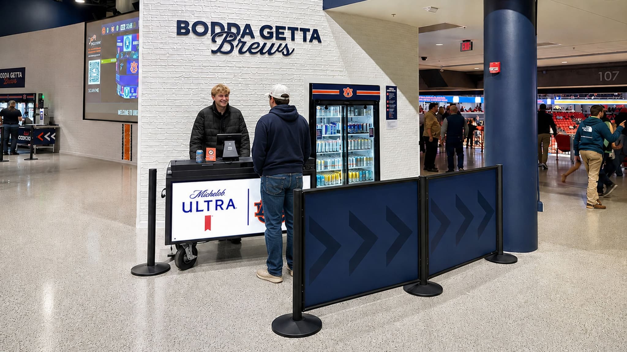 Post and Panel barriers with printed graphics guide fans to the concession counter at Auburn's Jordan-Hare Stadium.