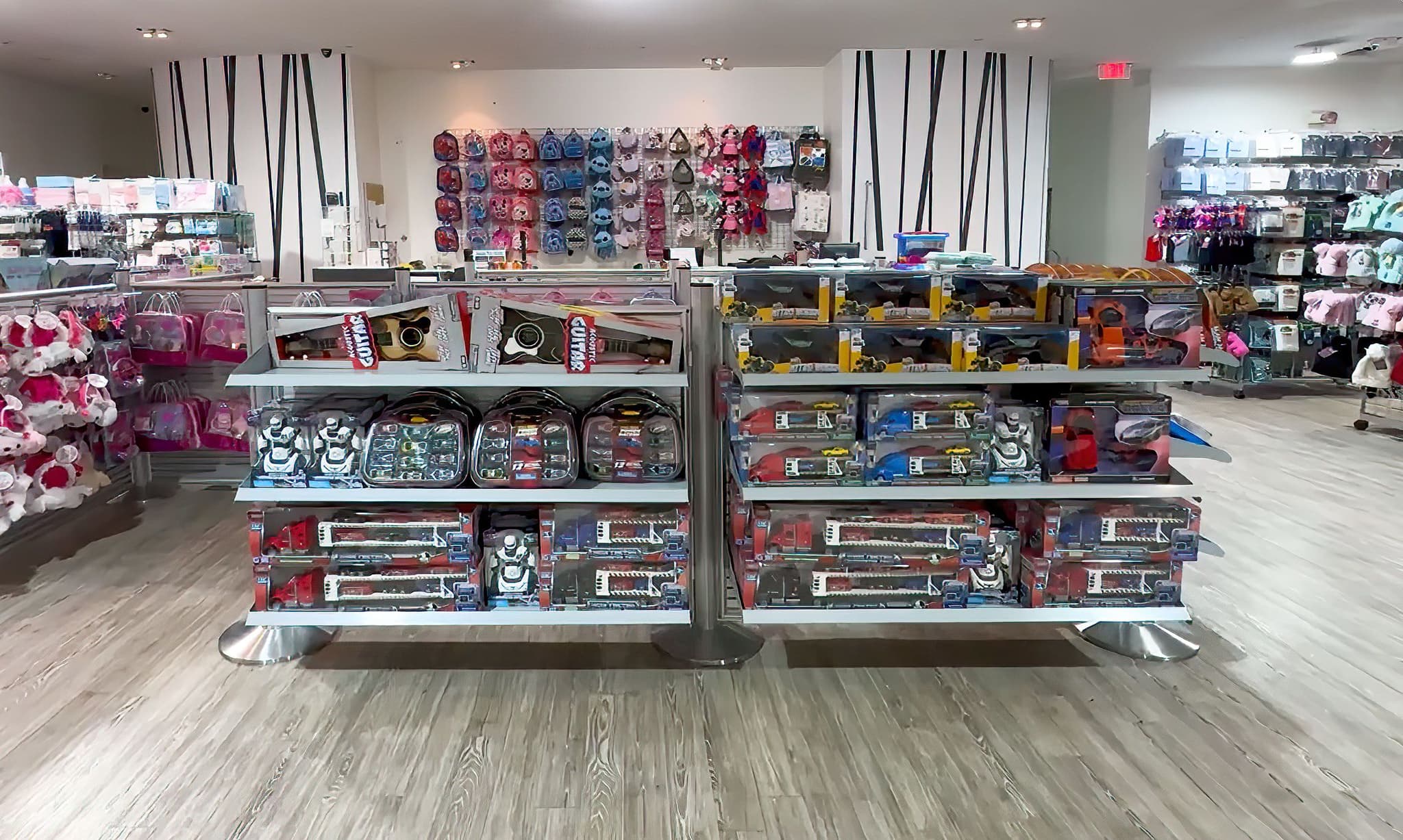 NeXtrac slatwall displays merchandise accessories along the checkout queue at an EB Apparel store.