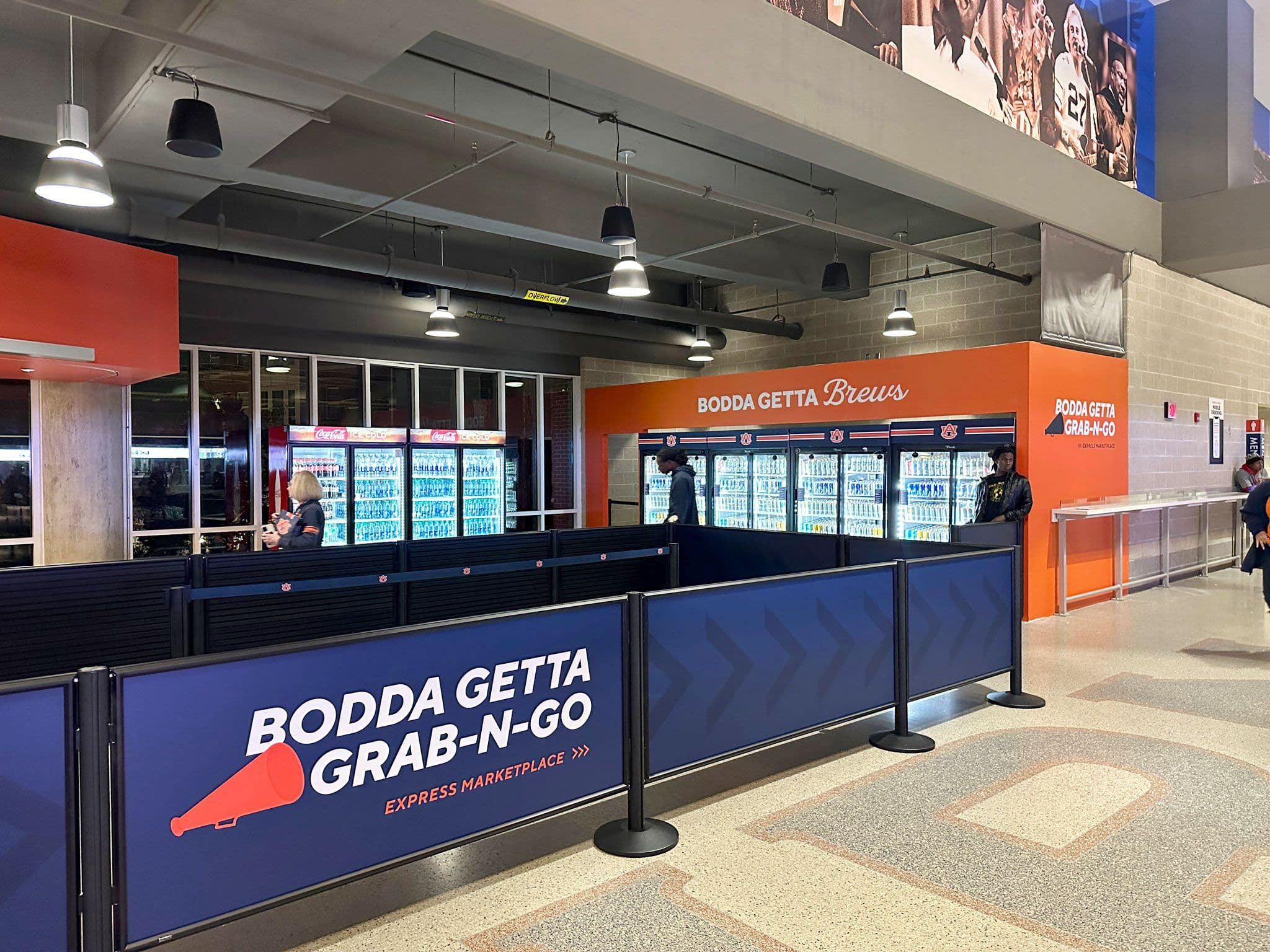 Post and Panel Barriers in a stadium concession queue