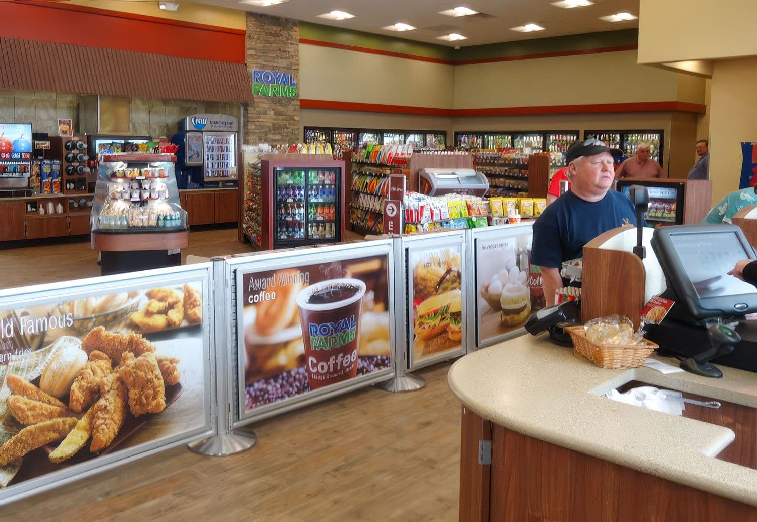 NeXtrac slatwall shelving merchandises the checkout queue at a Royal Farms convenience store.