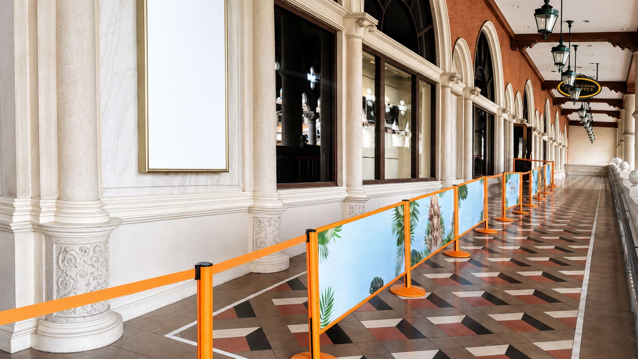 Beltrac retractable belt stanchions with gold posts guide guests along the entry walkway at TAO Beach Club in Las Vegas.