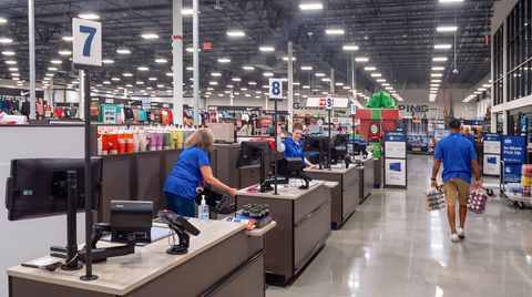 Electronic queuing checkout station lights at Academy Sports.