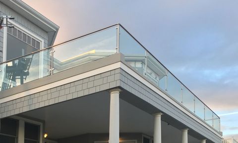 Round post glass railing guardrail on balcony