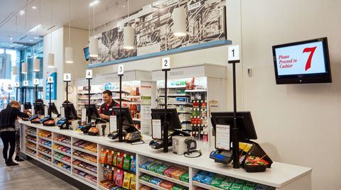 Lavi cashier station lights connected to an electronic queuing system at Walgreens