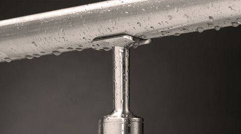 Close-up of marine-grade satin stainless steel handrail with water droplets