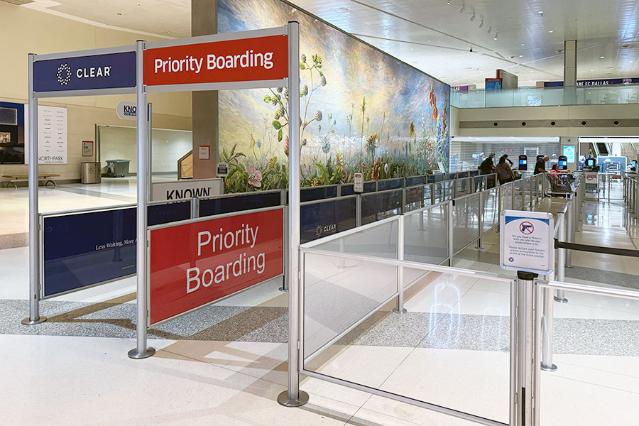 Overhead Signage directs passengers to correct queue