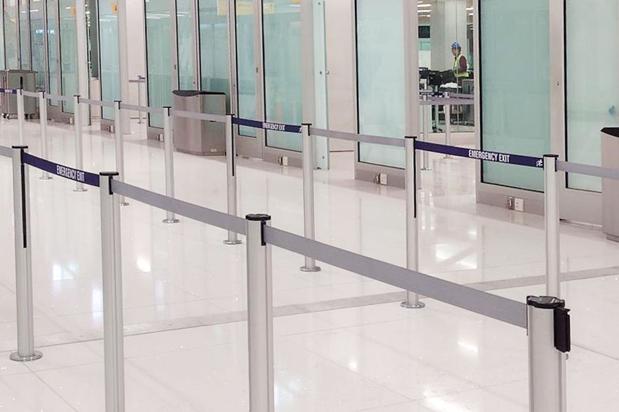 Emergency egress belts in an airport queue