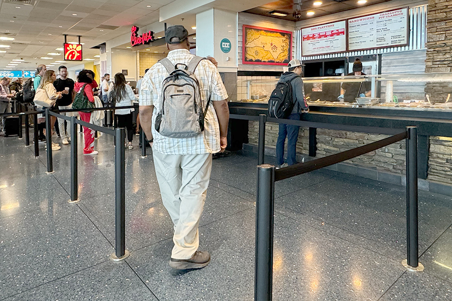 Man walking into queue at Chick-Fil-A