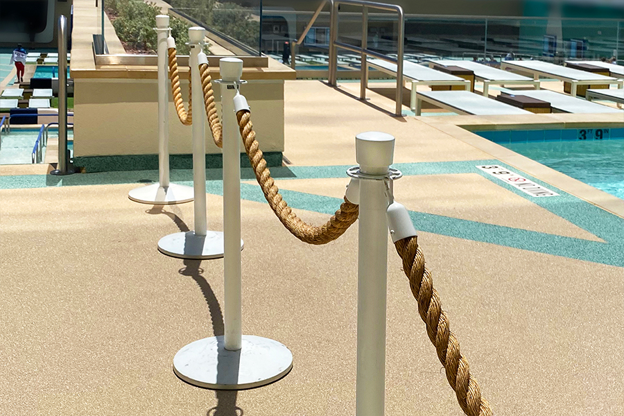 Rope stanchions block an area around a pool
