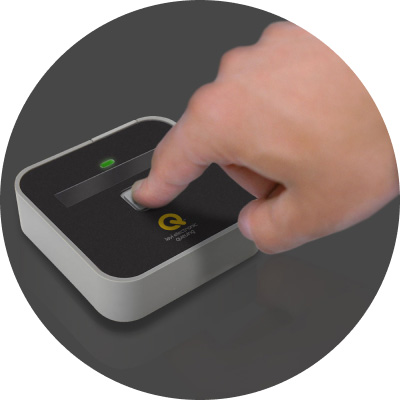 A finger easily interacting with the intuitive button interface of the Lavi Electronic Queuing station remote.